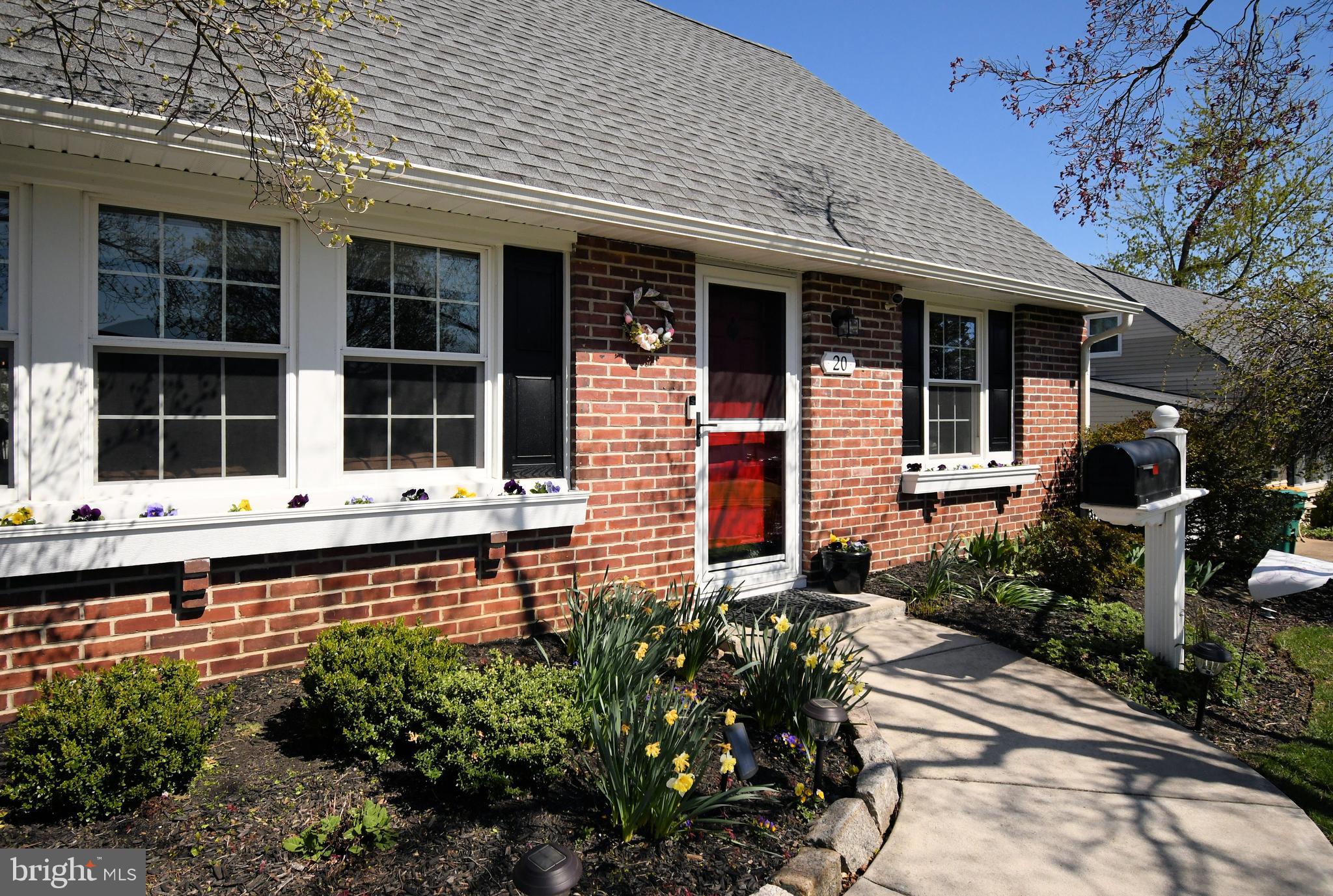 20 Conifer Road Levittown, PA 19057 - Photo 4 of 52 front view of a house with a large window and potted plants