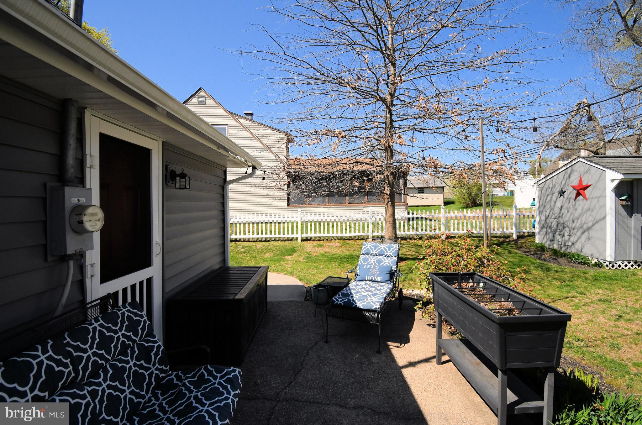 20 Conifer Road Levittown, PA 19057 - Photo 41 of 52 a view of a chairs and table in backyard of the house