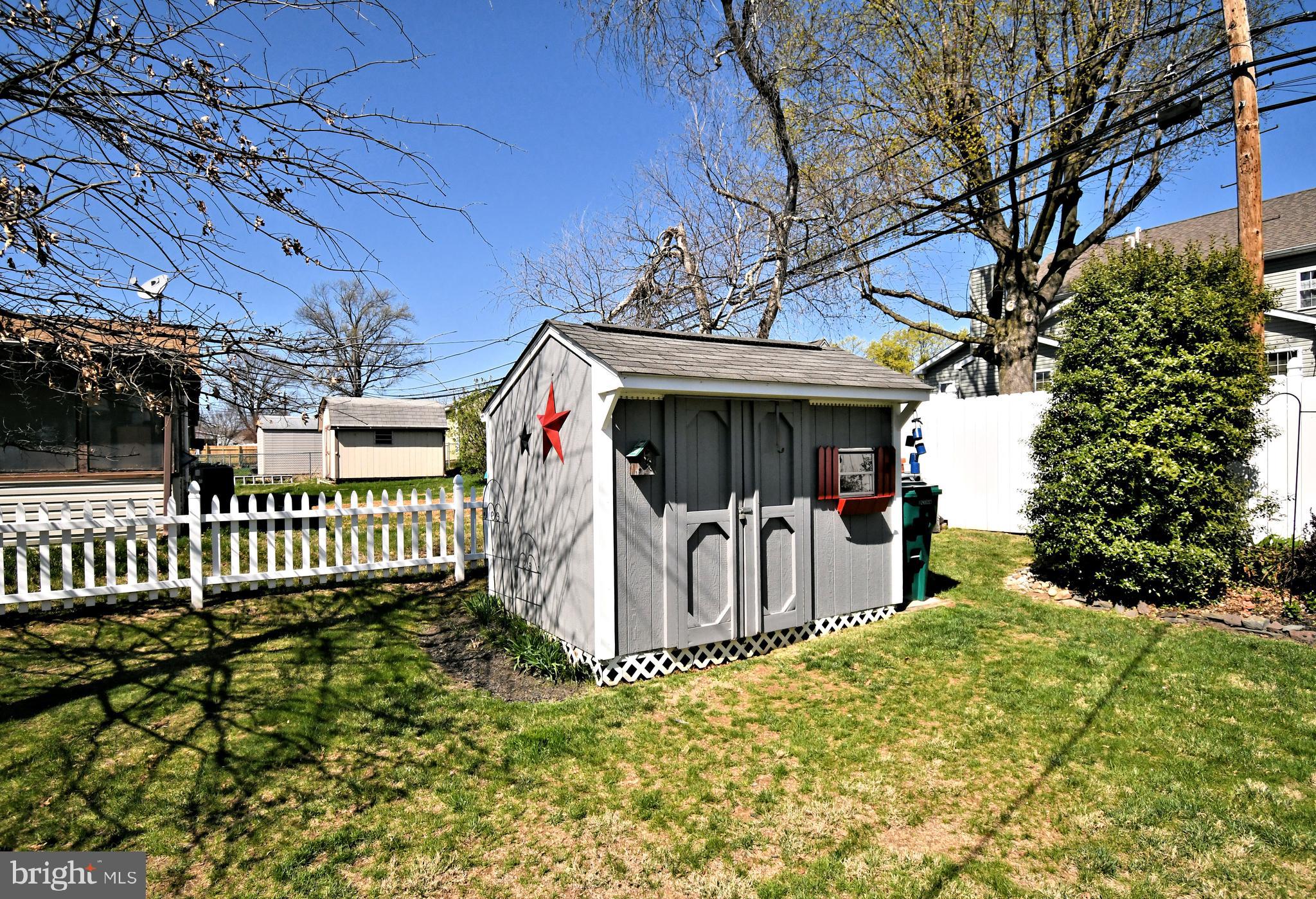 20 Conifer Road Levittown, PA 19057 - Photo 44 of 52 a view of a house with a small yard and wooden fence