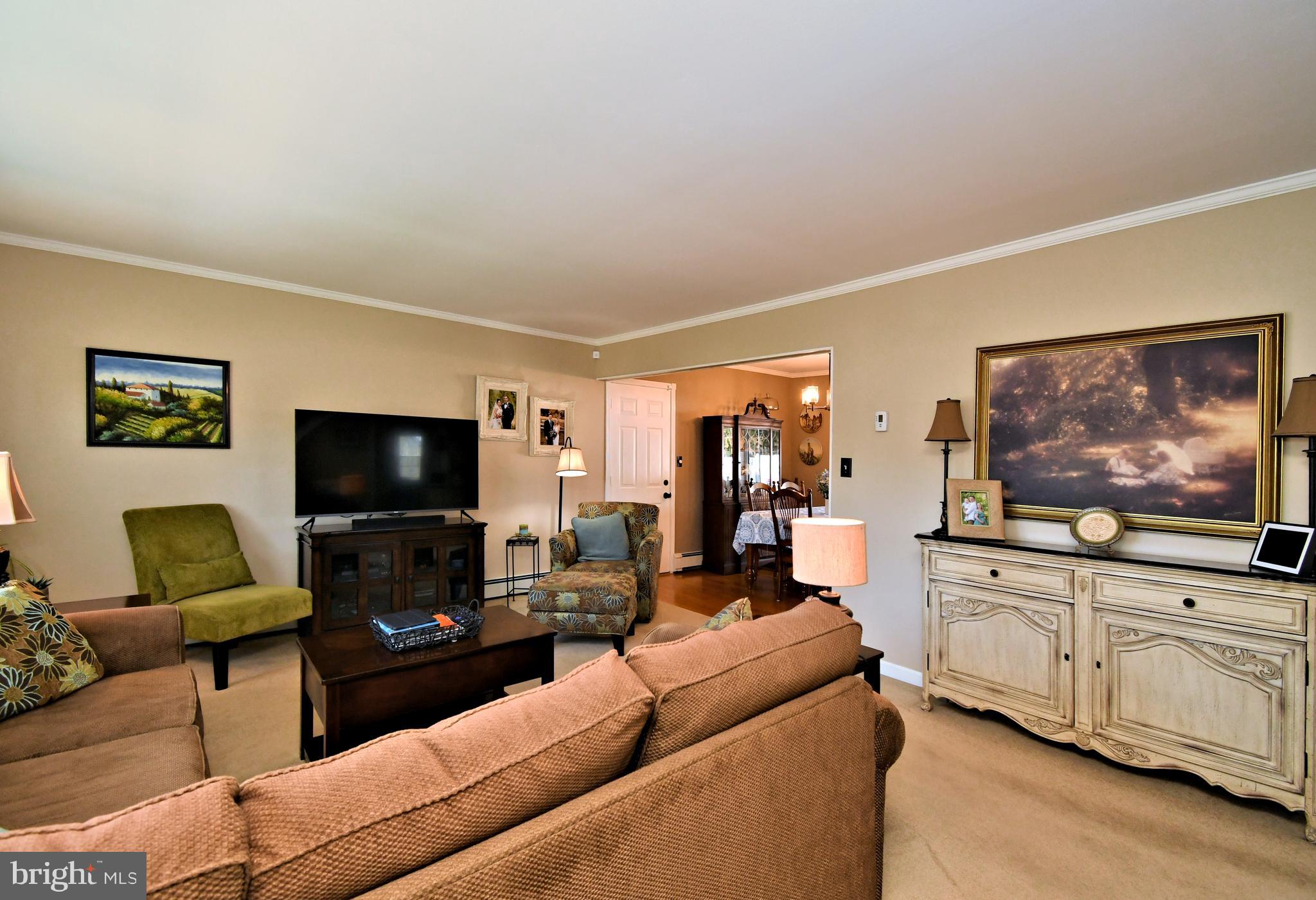 20 Conifer Road Levittown, PA 19057 - Photo 6 of 52 a living room with furniture and a flat screen tv