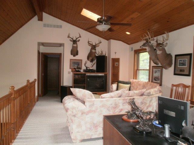 2590 East 1069th Road Oglesby, IL 61348 - Photo 3 of 15 a living room with furniture fireplace and flat screen tv