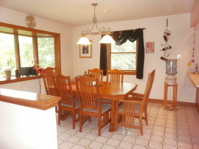 2590 East 1069th Road Oglesby, IL 61348 - Photo 7 of 15 a view of a dining room with furniture window and outside view