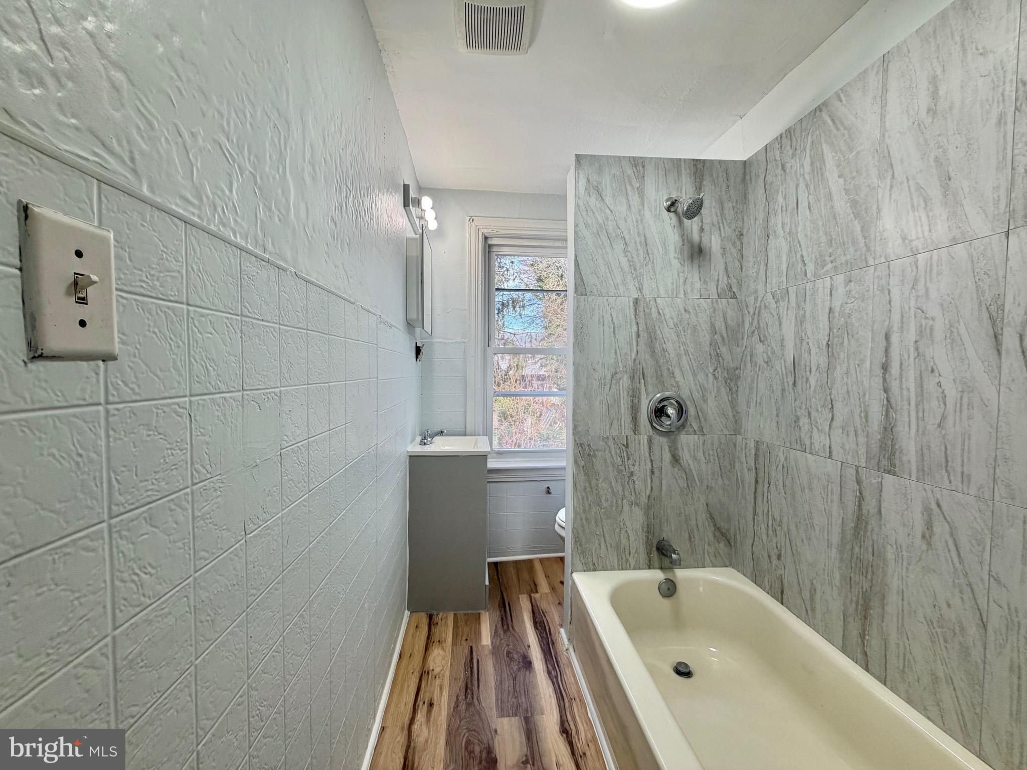 726 Genesee Street Trenton, NJ 08611 - Photo 11 of 15 a bathroom with a bathtub and shower