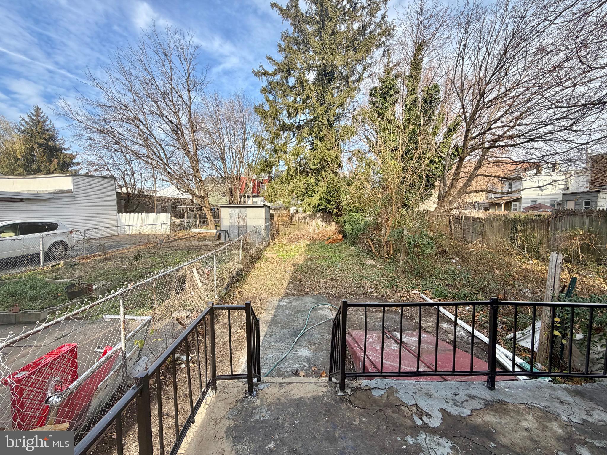 726 Genesee Street Trenton, NJ 08611 - Photo 15 of 15 a view of staircase with wooden fence and trees
