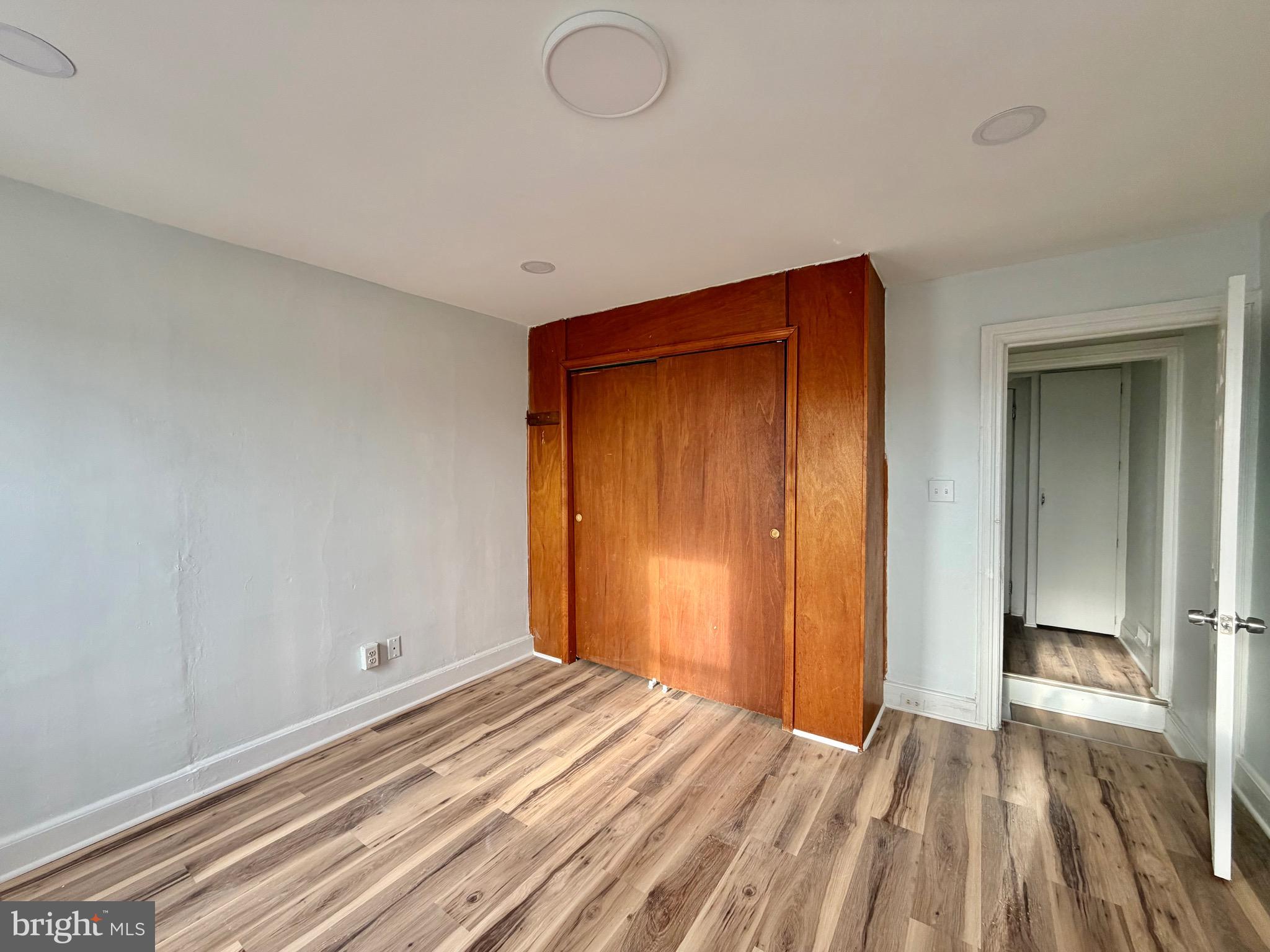 726 Genesee Street Trenton, NJ 08611 - Photo 10 of 15 a view of a room with wooden floor and bathroom