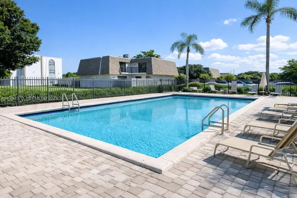 a view of a swimming pool with a lounge chairs