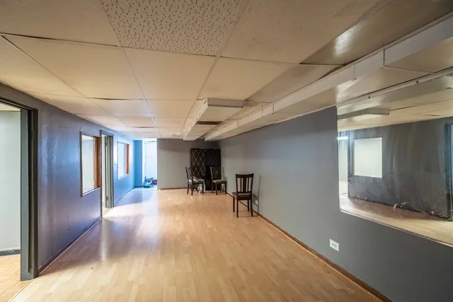 a view of bathroom with a sink and mirror