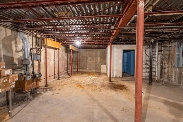 a view of empty room with wooden ceiling