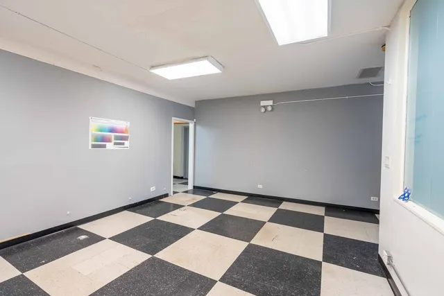 a view of a room with a black and white checkered floor