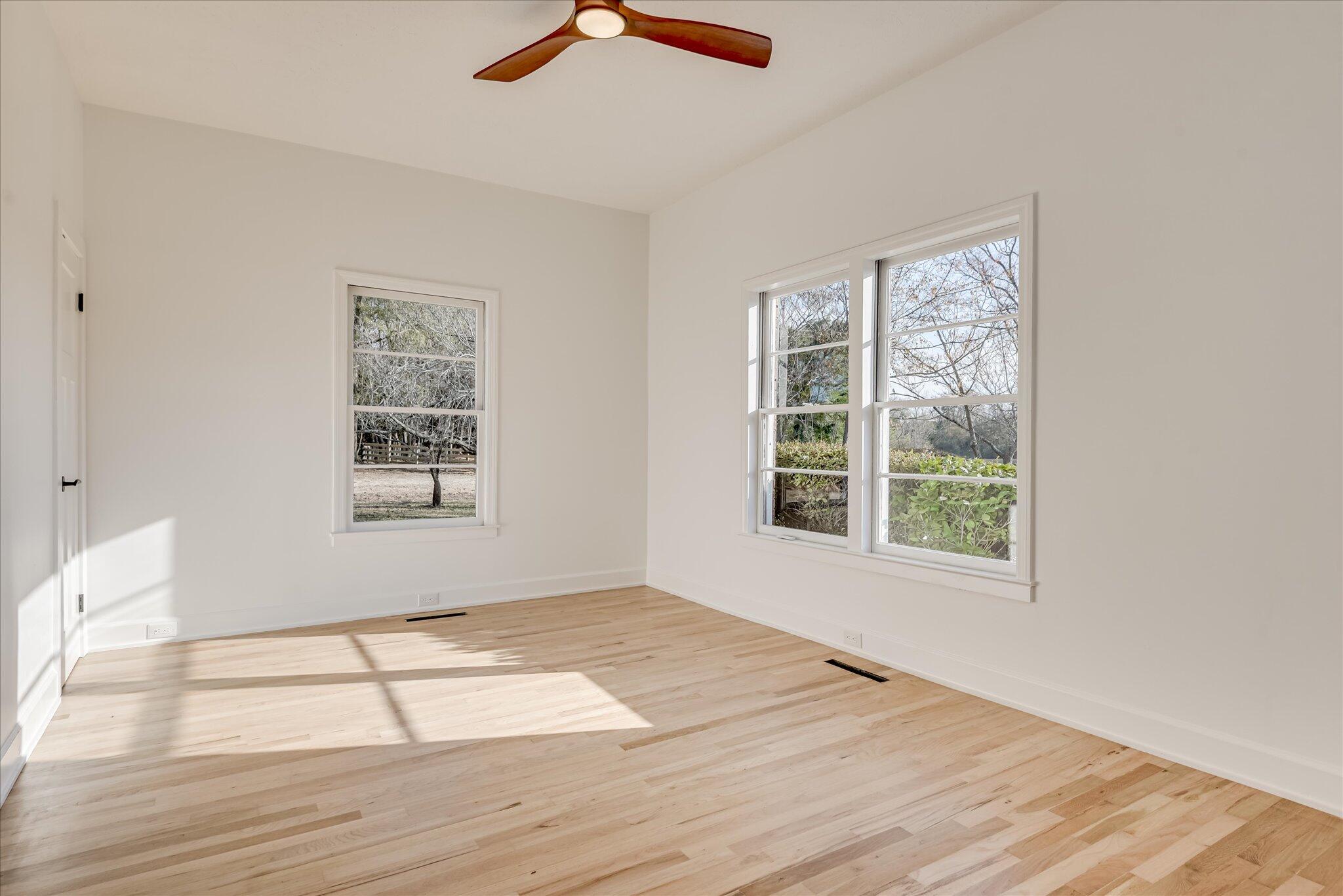 126 Mosley Road Aiken, SC 29801 - Photo 18 of 29 an empty room with wooden floor and windows