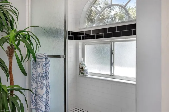 a bathroom with a sink mirror and vanity