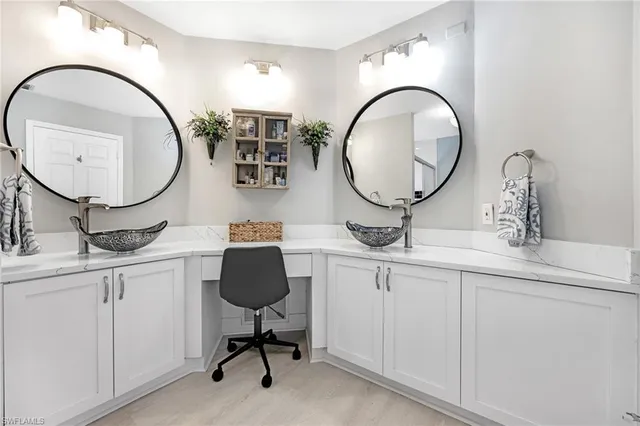 a bedroom with a bed and a television