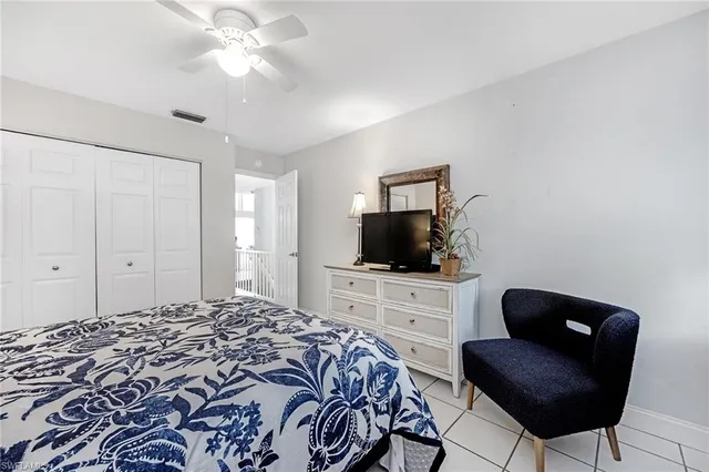 a bathroom with a double vanity sink mirror and toilet