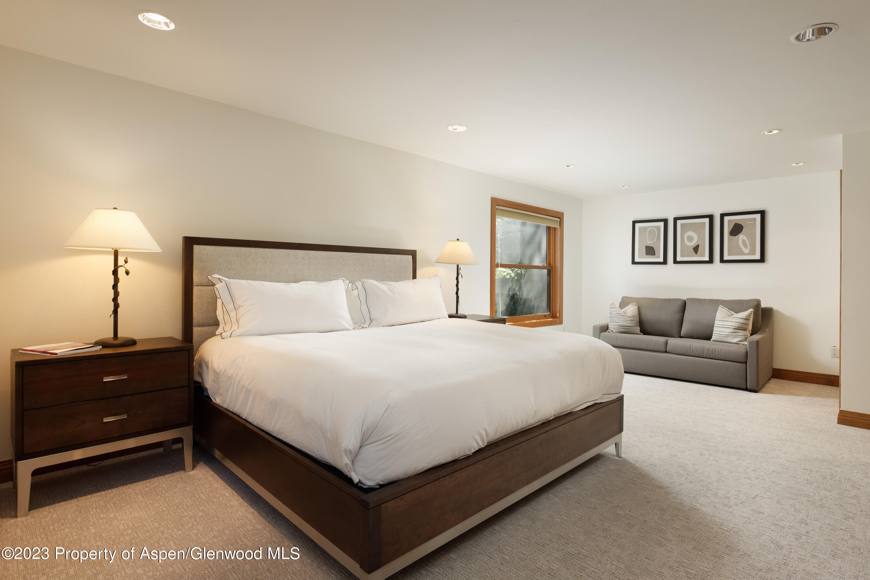 728 South Galena Street, Unit B201 Aspen, CO 81611 - Photo 12 of 18 a bedroom with a bed and lamp