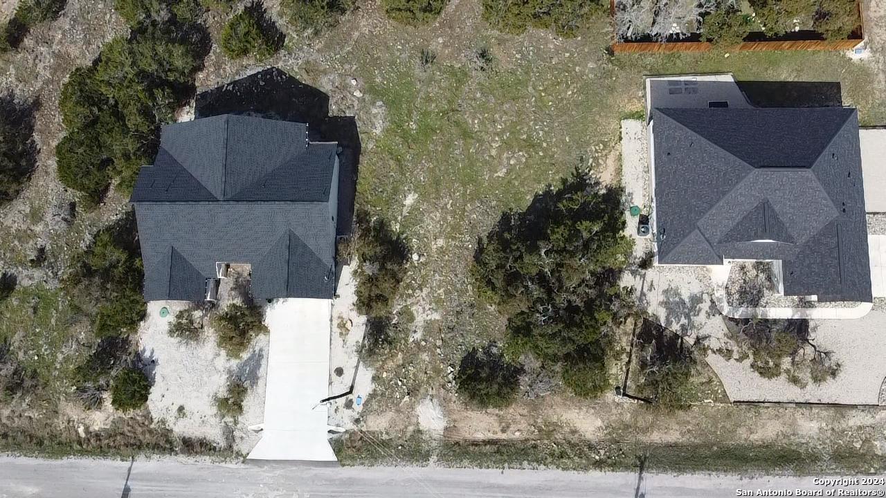 105 James Box Blanco, TX 78606 - Photo 2 of 5 front view of a house with a yard