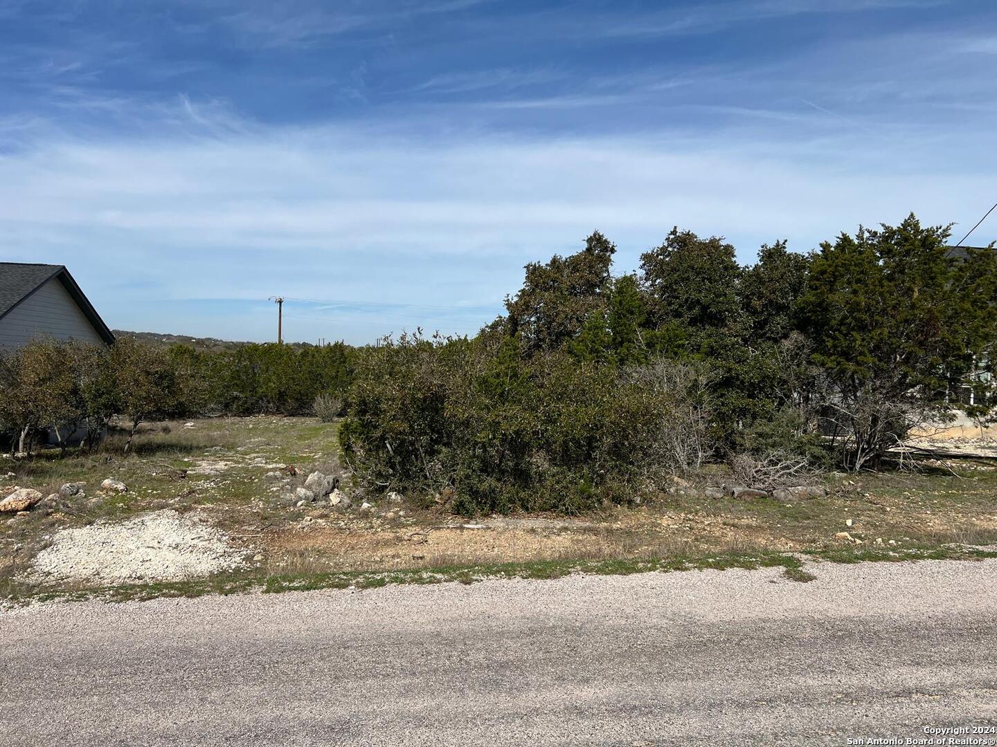 105 James Box Blanco, TX 78606 - Photo 3 of 5 a view of a lake with a big yard