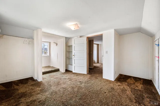 a view of balcony with chairs and wooden floor