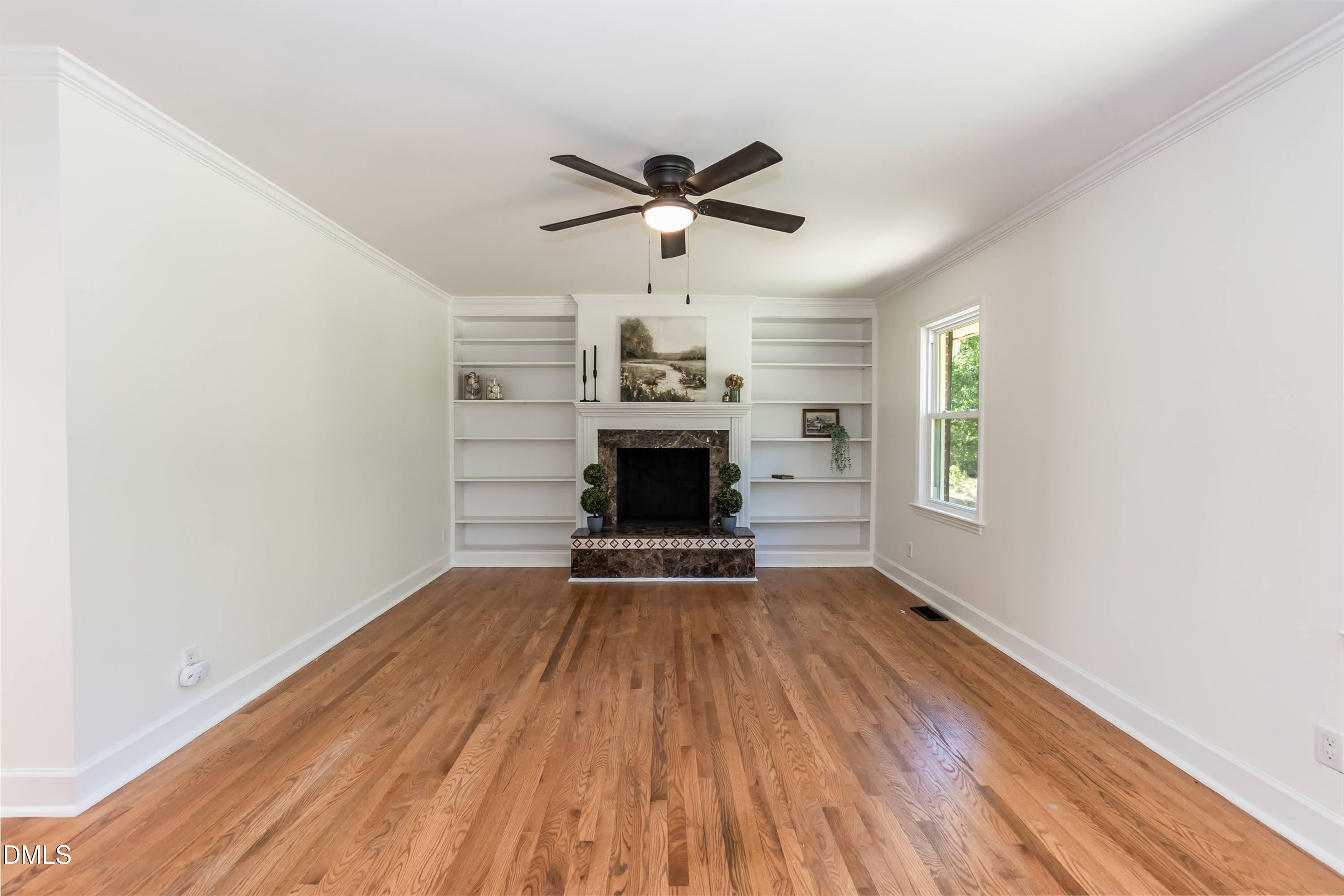 641 Rocky Ford Road Louisburg, NC 27549 - Photo 25 of 38 wooden floor in an empty room with a window