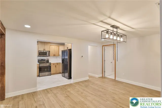 a kitchen with a sink cabinets and a window