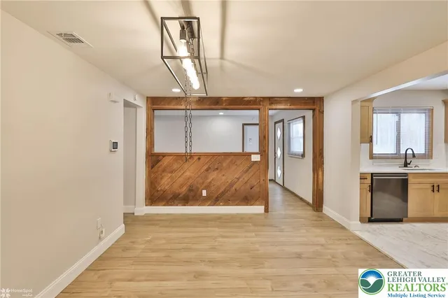 a en suite bathroom with a sink a mirror and shower