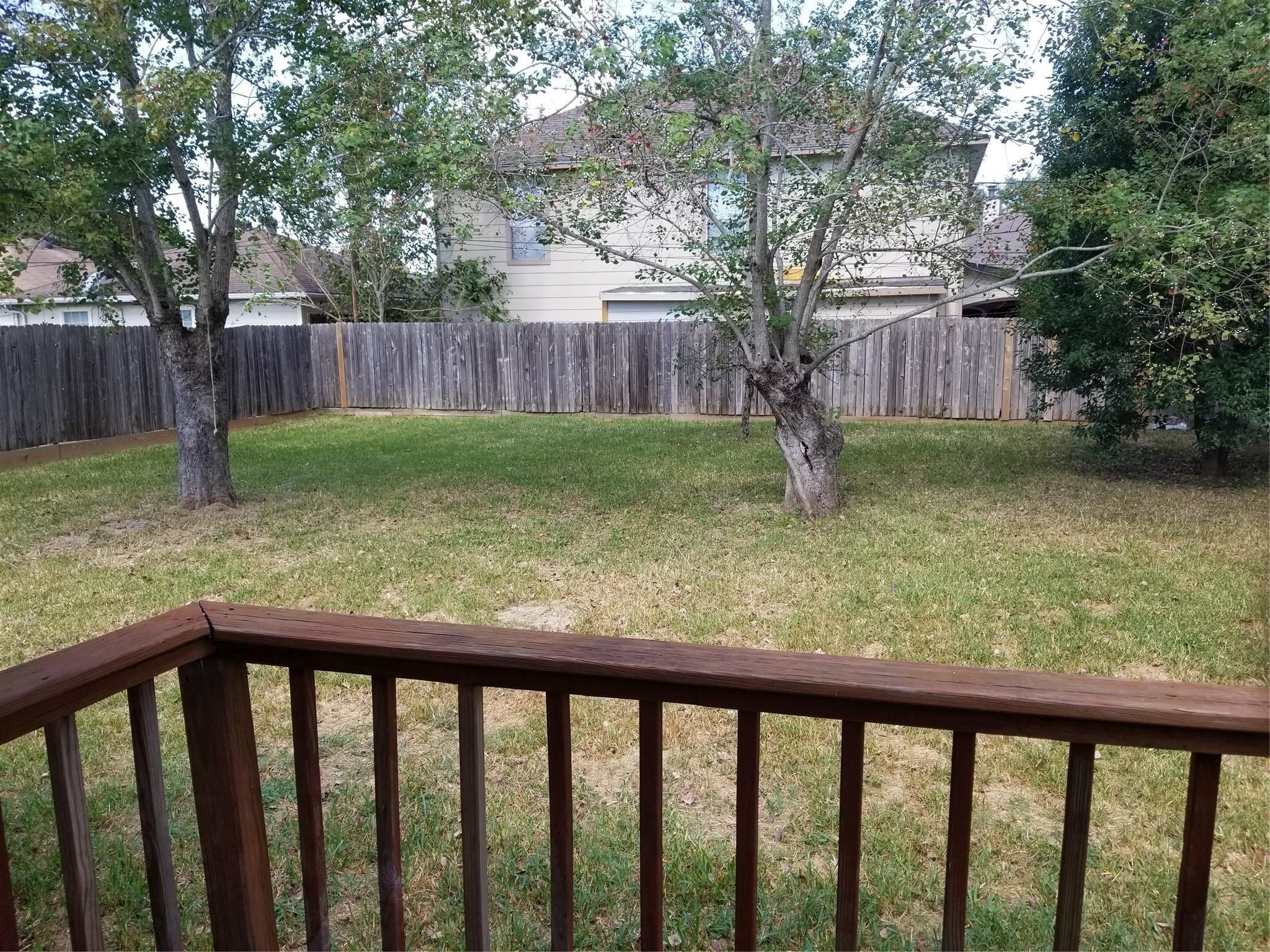 8331 Swiftwater Lane Houston, TX 77075 - Photo 11 of 14 a view of a yard with wooden fence