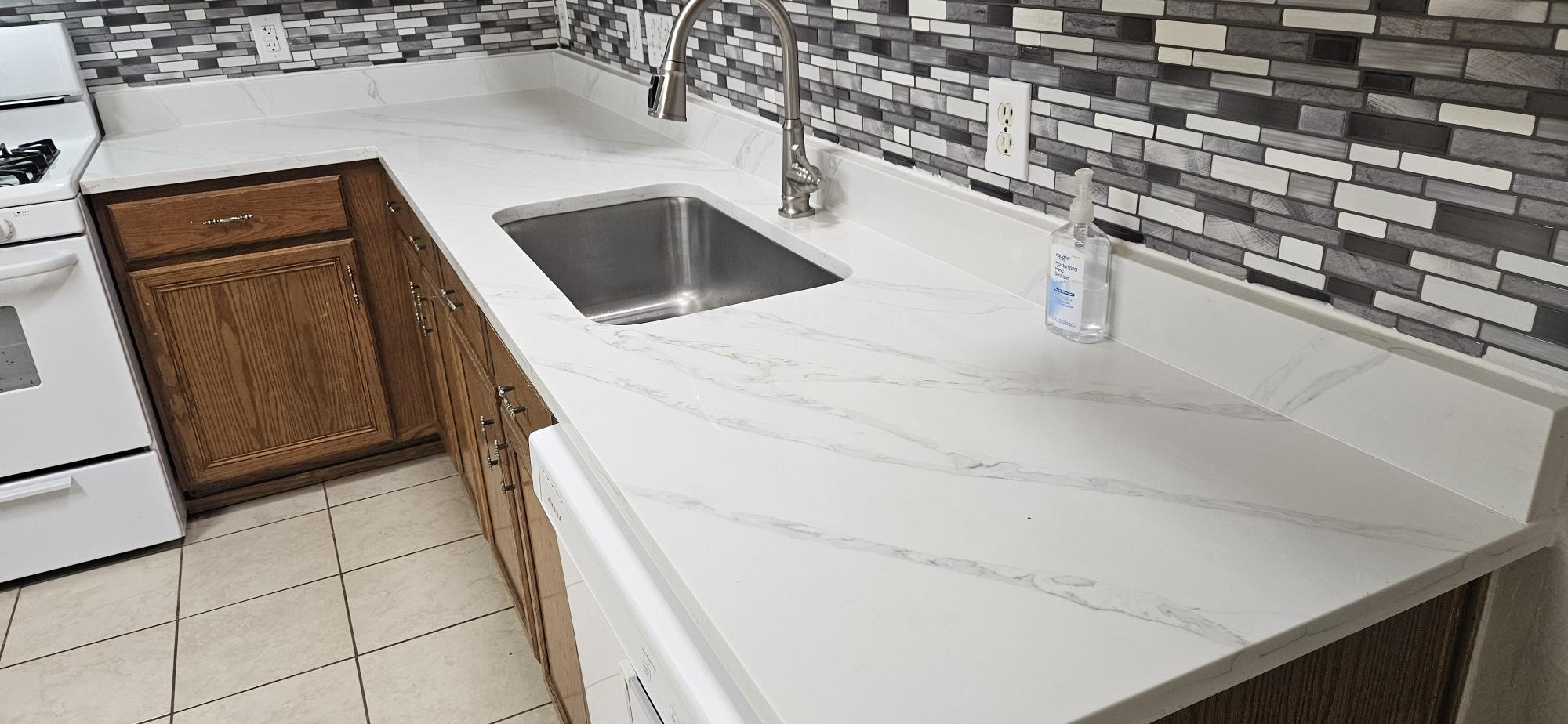 8331 Swiftwater Lane Houston, TX 77075 - Photo 3 of 14 a utility room with a sink a washer and dryer