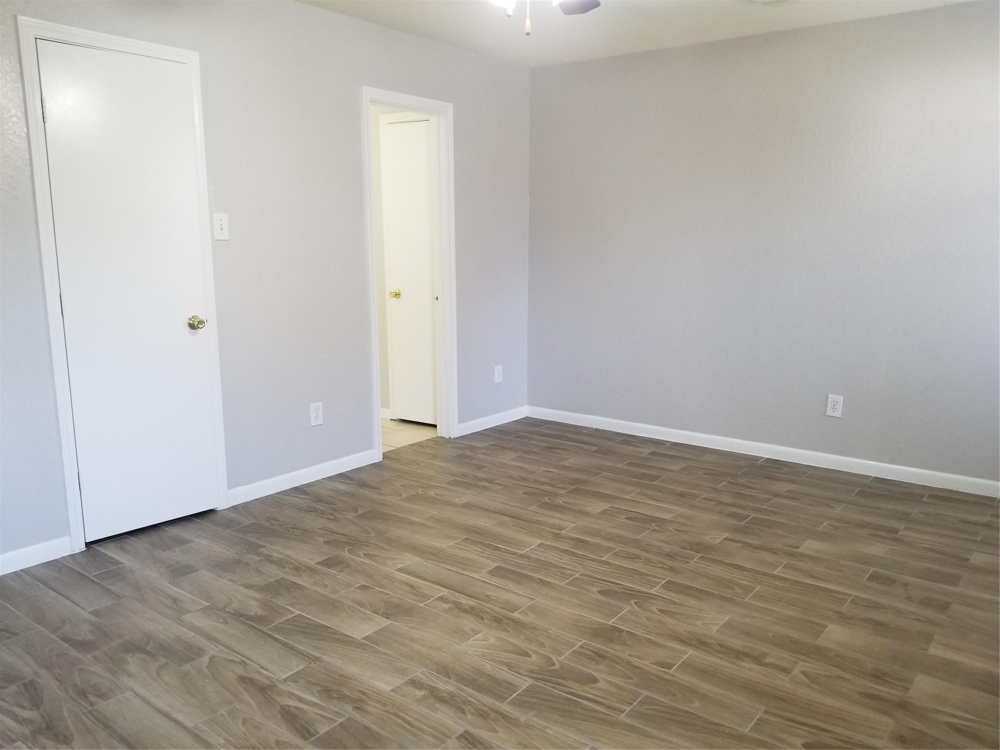 8331 Swiftwater Lane Houston, TX 77075 - Photo 6 of 14 a view of empty room with wooden floor