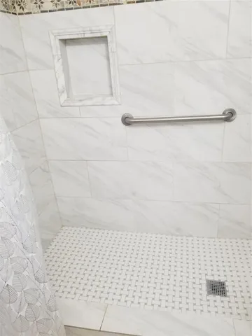 a bathroom with a shower and a toilet