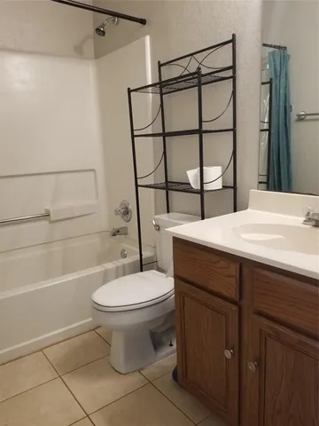 a view of a yard with wooden fence