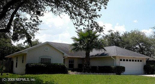 138 Orchis Road St. Augustine, FL 32086 - Photo 1 of 3 a front view of house with yard and green space