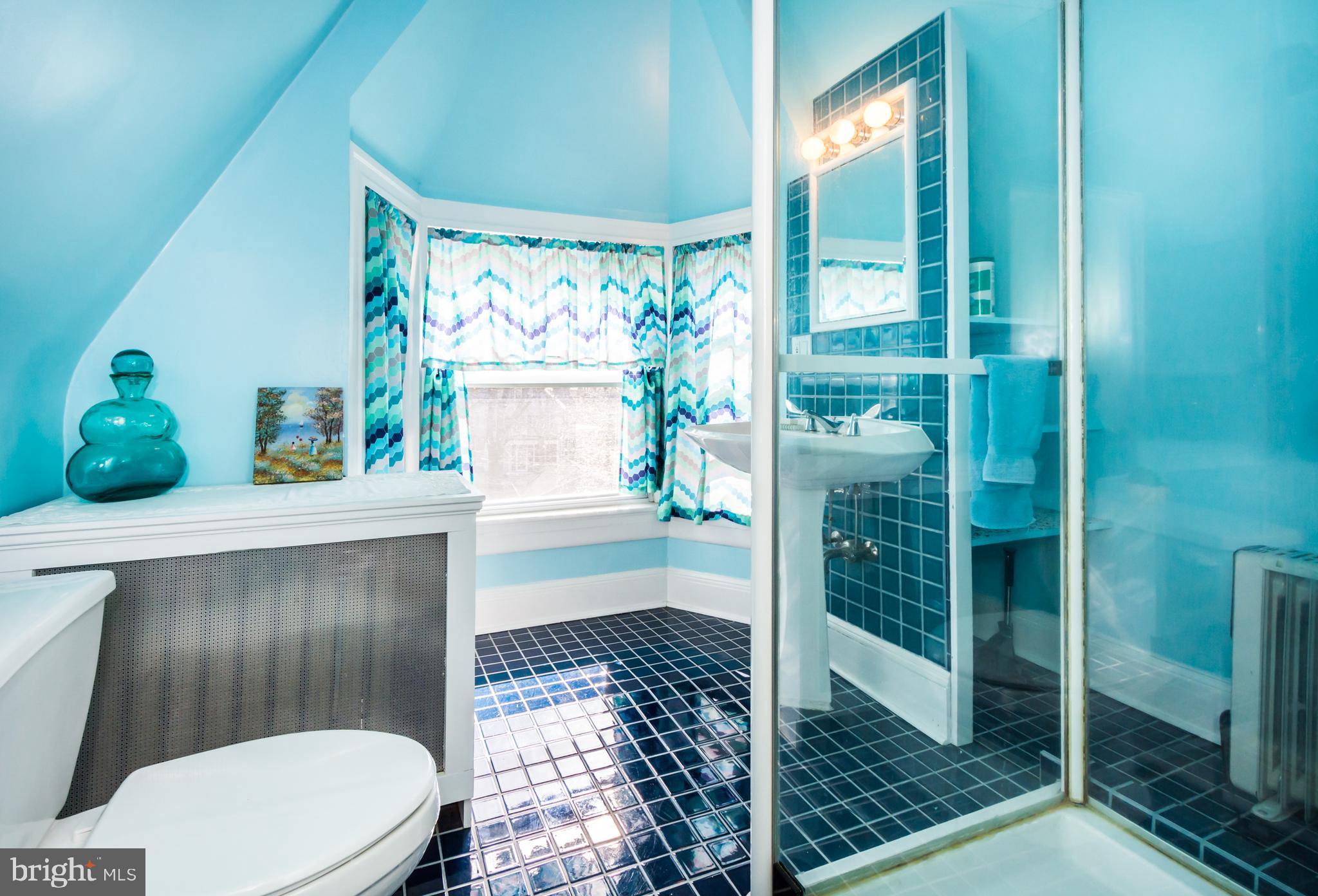319 Woodlawn Road Baltimore, MD 21210 - Photo 62 of 66 3rd Floor tiled, cheery Bath.