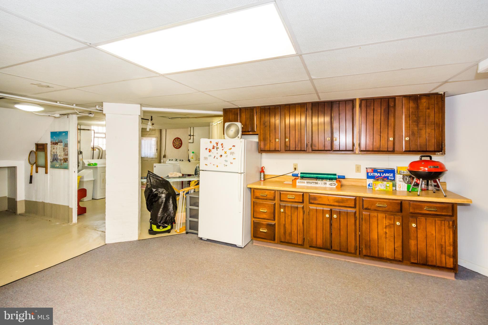 319 Woodlawn Road Baltimore, MD 21210 - Photo 63 of 66 Partially finished Basement w/useful cabinetry.