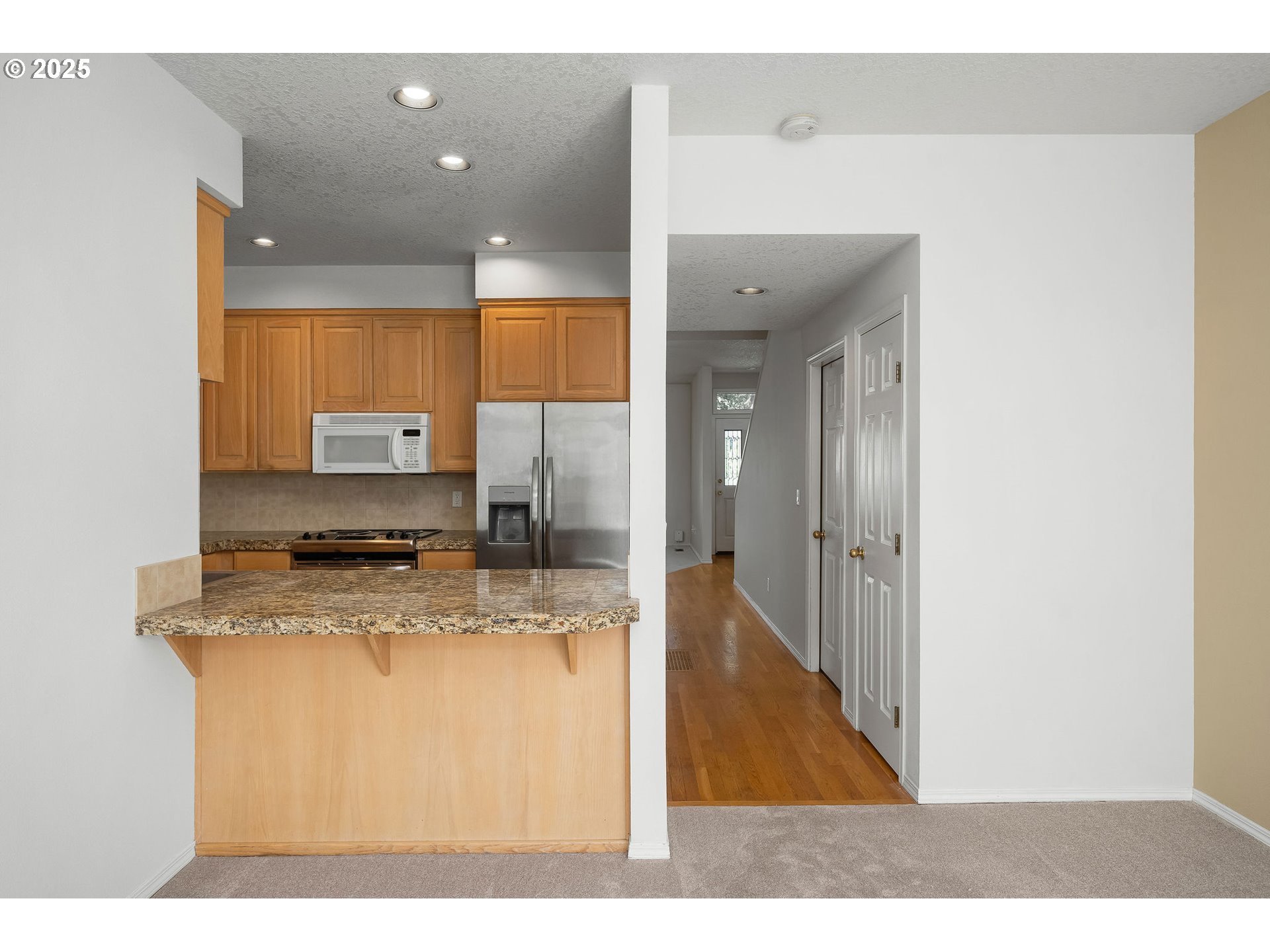 236 South Sweeney Street Portland, OR 97239 - Photo 11 of 29 a view of a living room with kitchen island granite countertop furniture