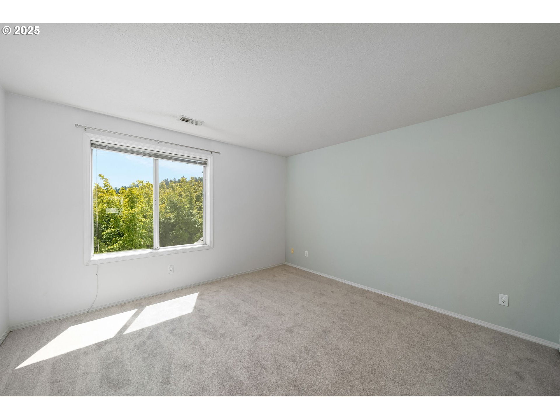 236 South Sweeney Street Portland, OR 97239 - Photo 20 of 29 a view of an empty room with a window
