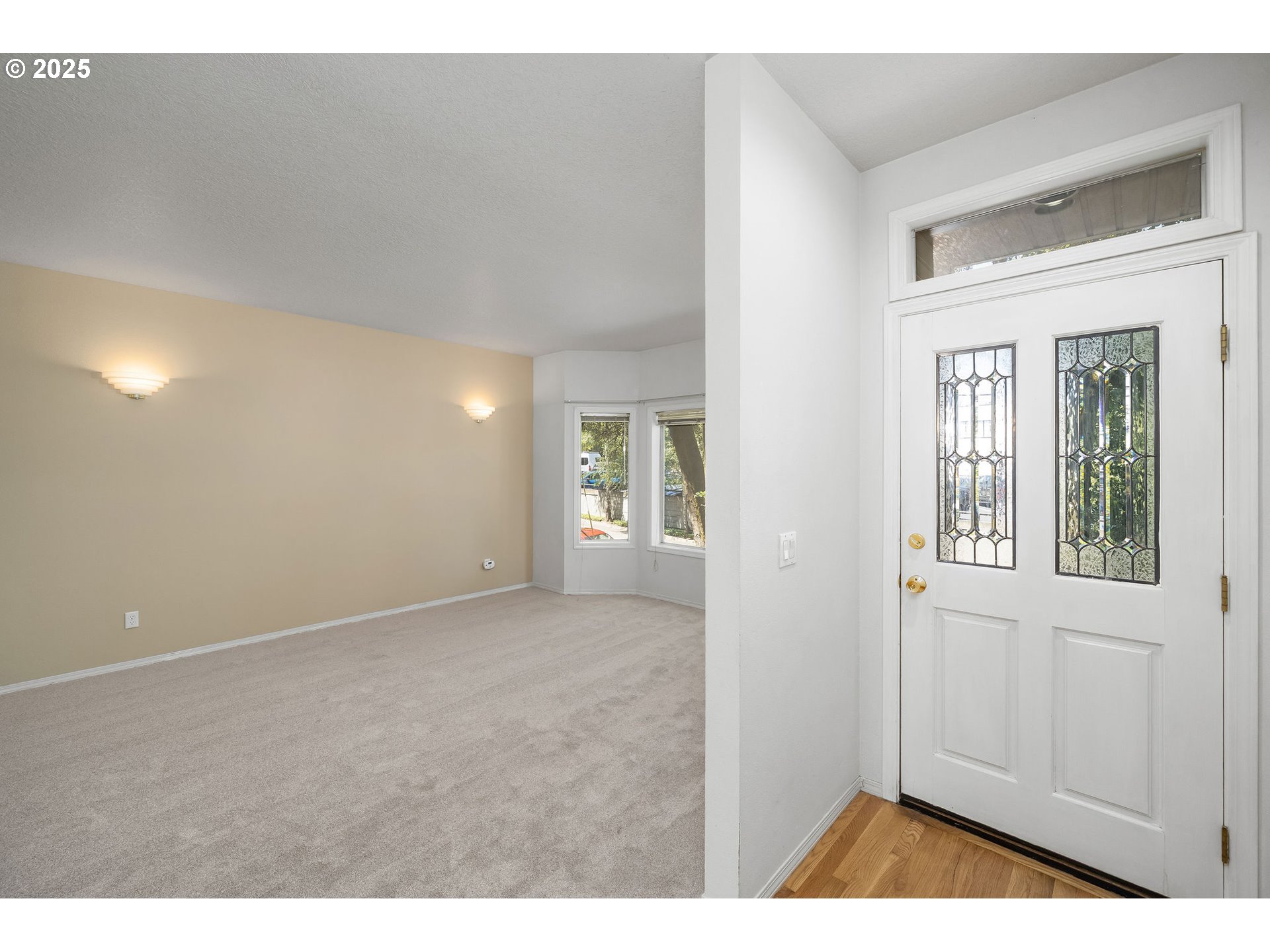 236 South Sweeney Street Portland, OR 97239 - Photo 2 of 29 a view of an empty room with chandelier and a window