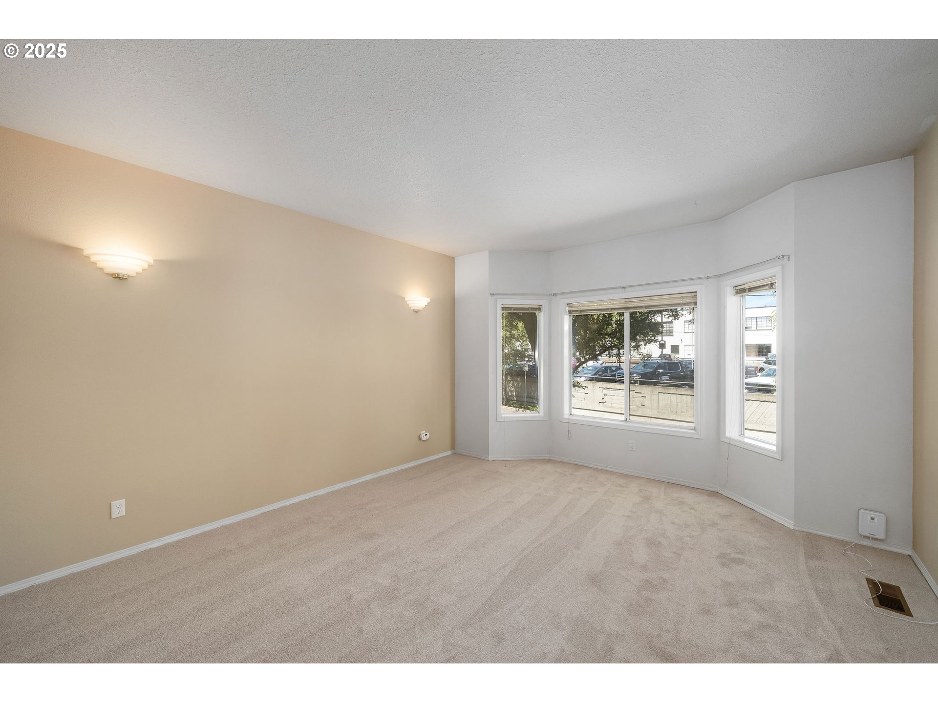 236 South Sweeney Street Portland, OR 97239 - Photo 5 of 29 a view of an empty room with a window
