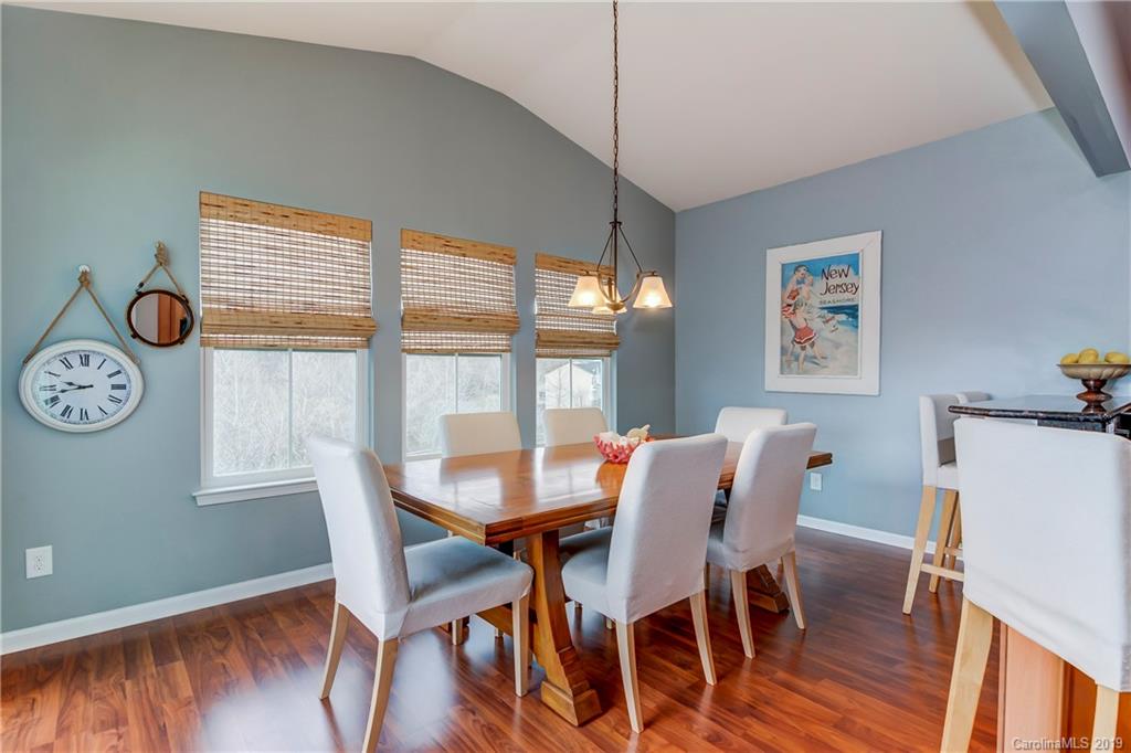 7512 West Berkeley Road Denver, NC 28037 - Photo 12 of 32 a view of a dining room with furniture large window and wooden floor