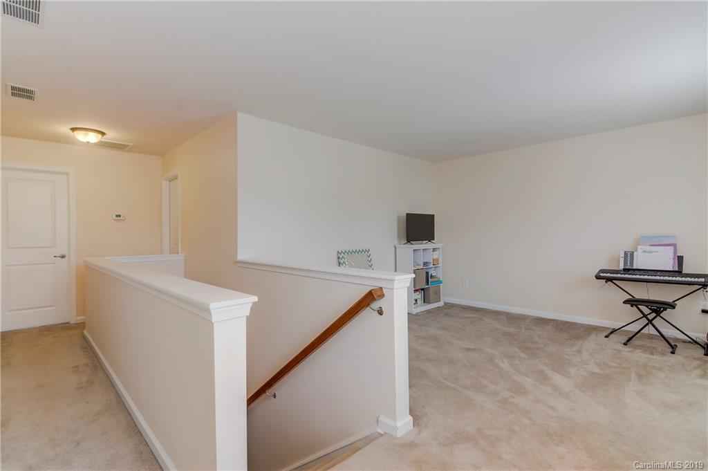 7512 West Berkeley Road Denver, NC 28037 - Photo 14 of 32 a view of a hallway with workspace