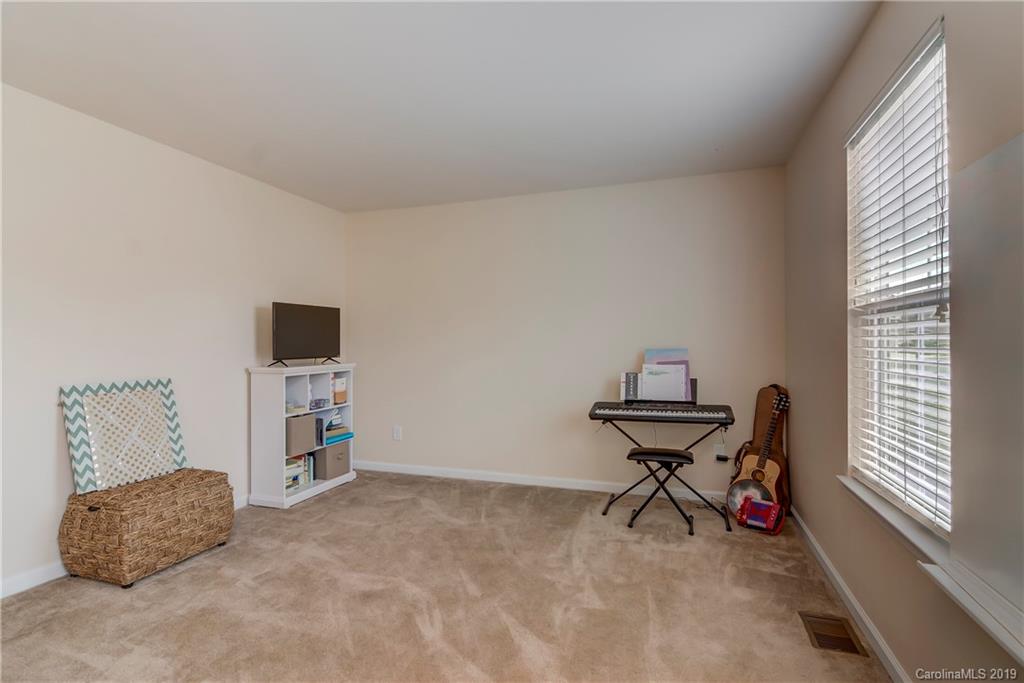 7512 West Berkeley Road Denver, NC 28037 - Photo 15 of 32 a living room with furniture and a window