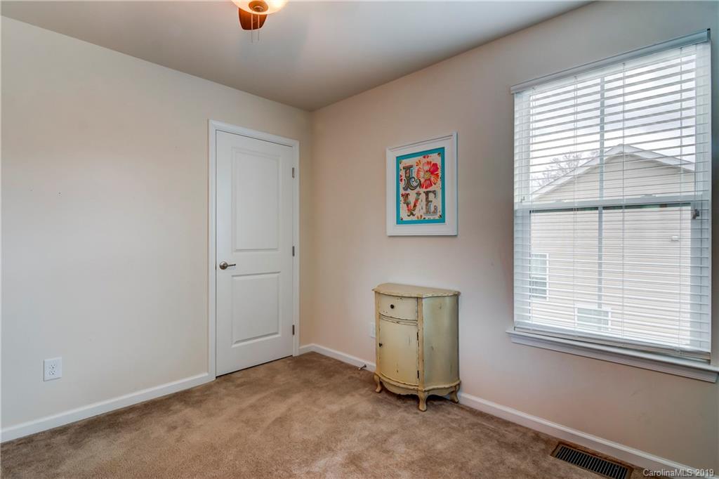 7512 West Berkeley Road Denver, NC 28037 - Photo 19 of 32 an empty room with windows