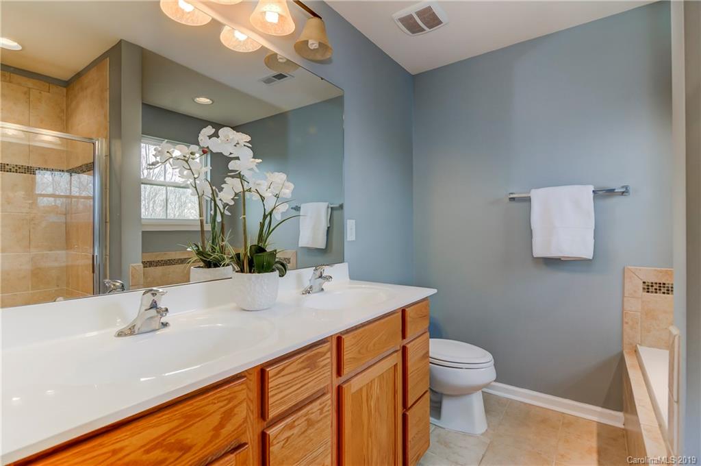 7512 West Berkeley Road Denver, NC 28037 - Photo 20 of 32 a bathroom with a sink toilet and shower