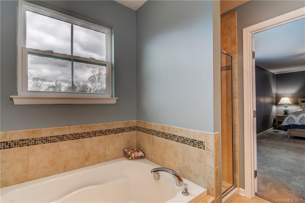 7512 West Berkeley Road Denver, NC 28037 - Photo 21 of 32 a bathroom with a tub and a view of bathroom