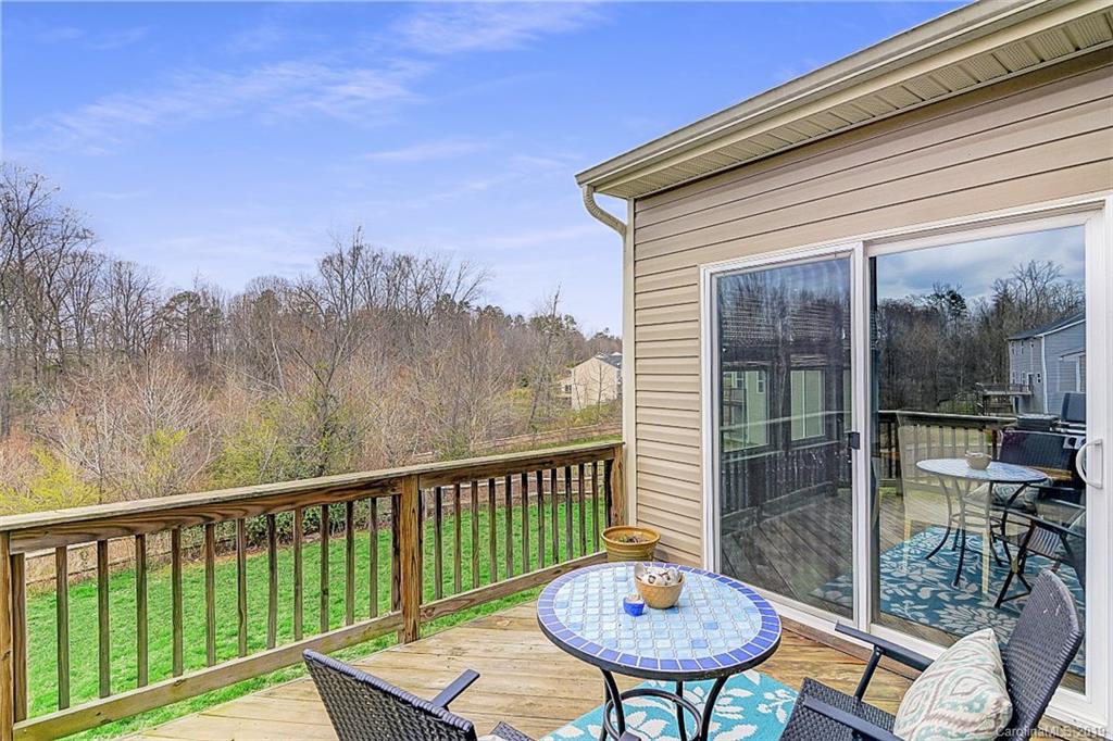 7512 West Berkeley Road Denver, NC 28037 - Photo 30 of 32 a view of a balcony with a table and chairs