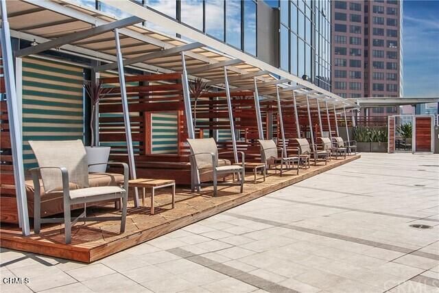 a view of house with outdoor seating area