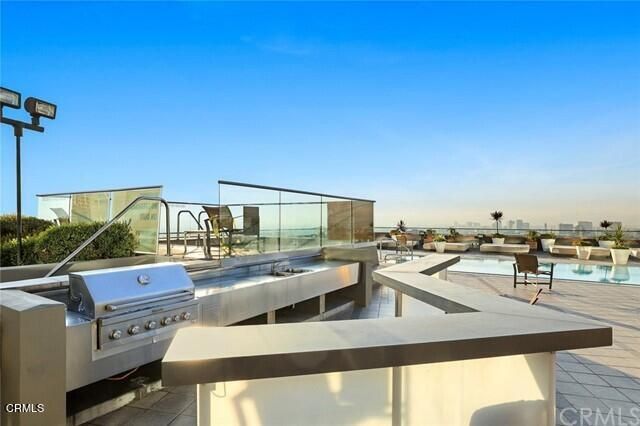 a view of a swimming pool with a patio