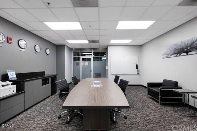 a room with furniture pool table and a rug
