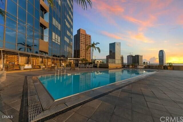 a view of swimming pool from a balcony
