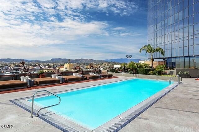 a room with lots of furniture and air hockey table