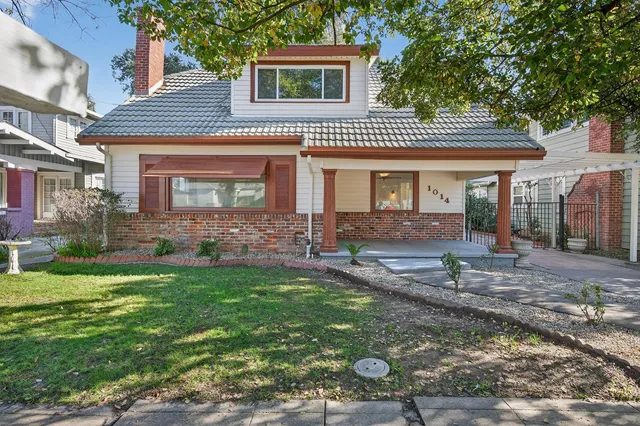 a front view of a house with garden