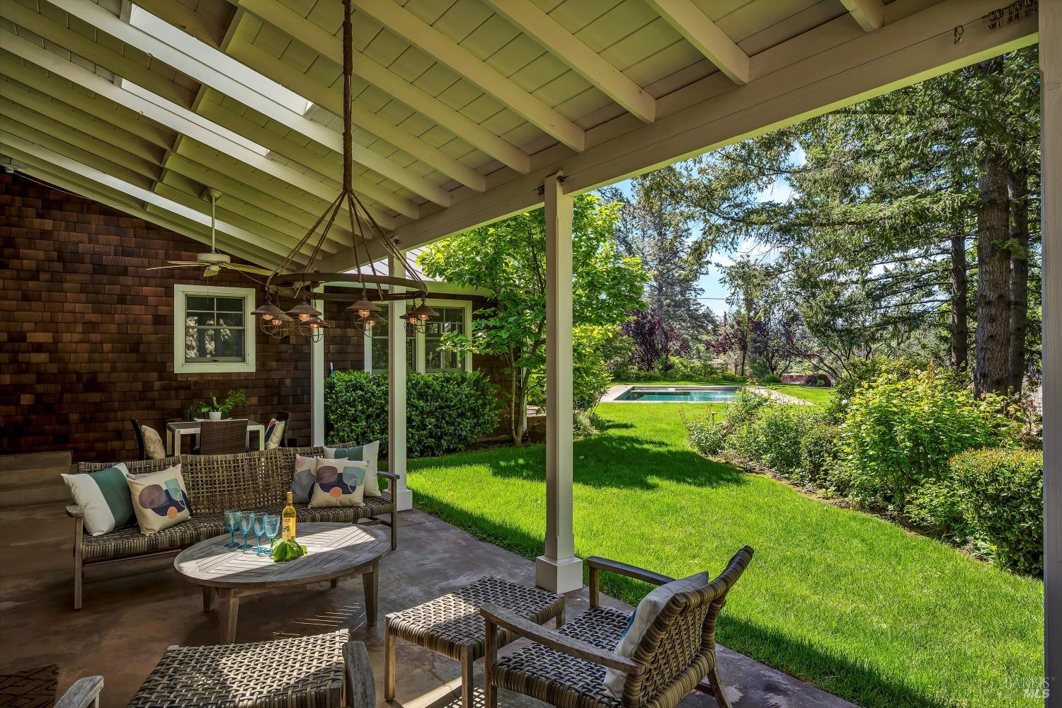 1065 Summit Lake Drive Angwin, CA 94508 - Photo 13 of 47 a view of a patio with a table chairs and a backyard